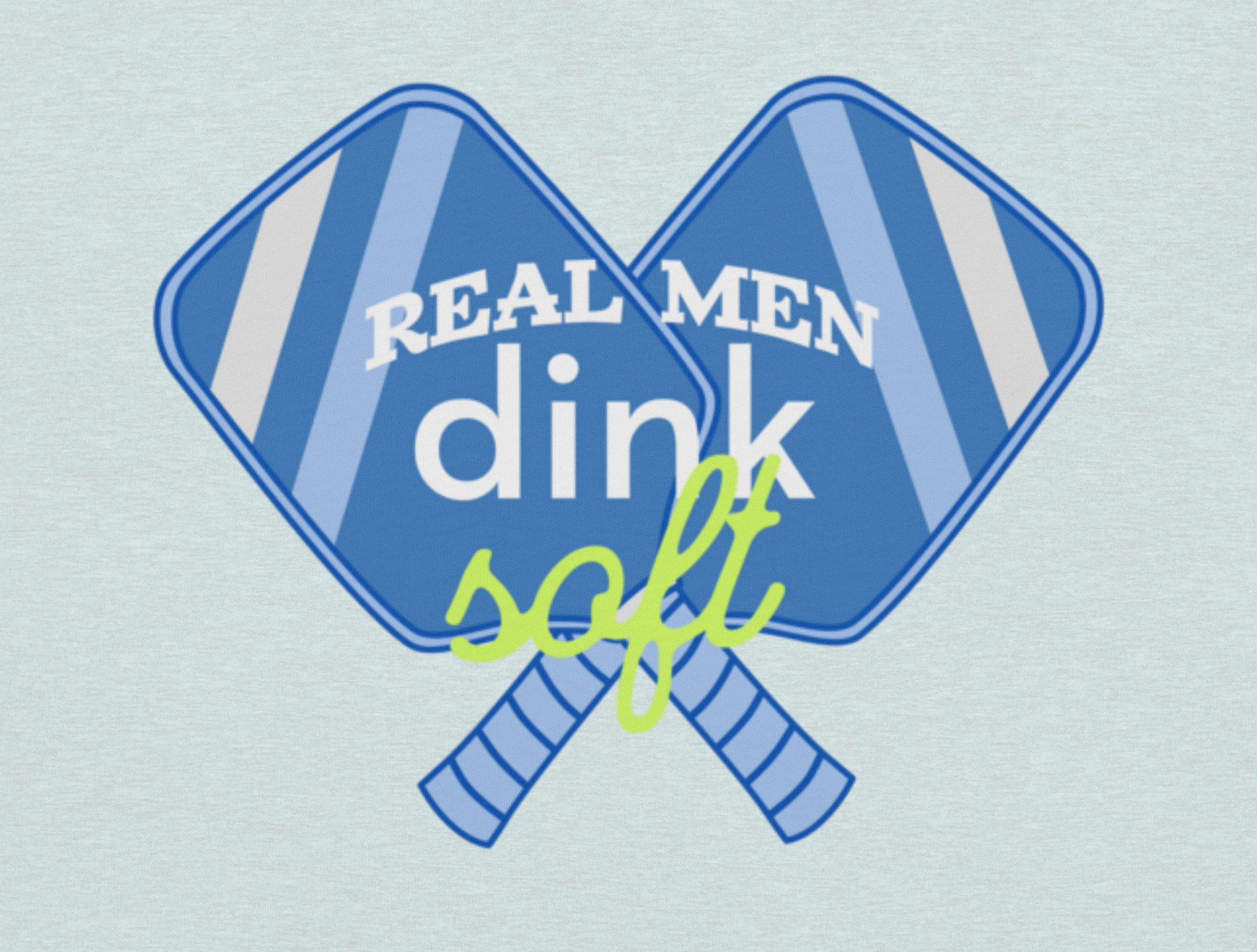 Two crossed paddles with text 'Real Men Dink Soft' on a light blue background